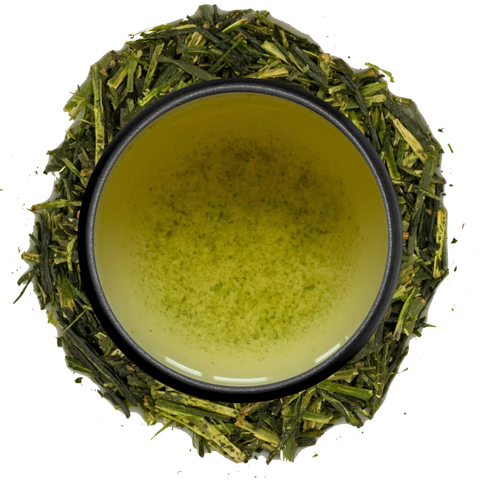 A cup of pale kukicha seen from above, ringed by kukicha stems and twigs on a white background